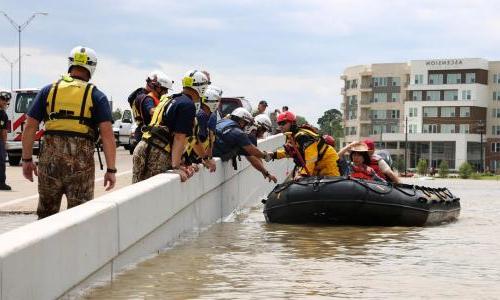 Raft rescuing flood victims in Houston, TX